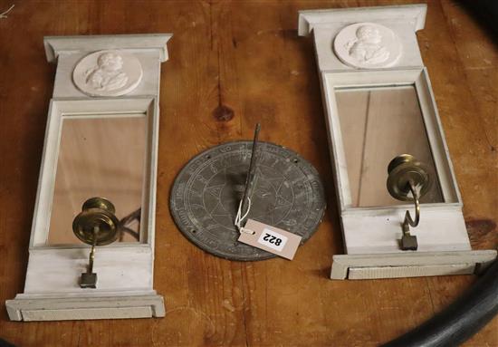 A pair of mirrored candle sconces and a sundial Sconces H.44cm